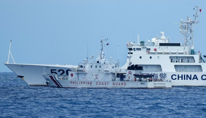 Chinese ship blocks Philippine vessel as journalists watch Report